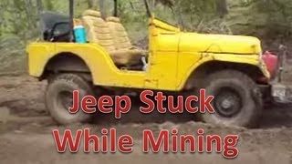 Jeep buried in the mud.