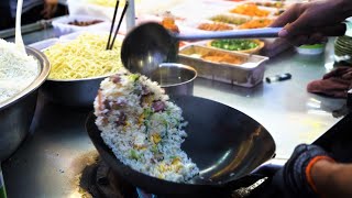Chinese Street Food -Fried rice with eggs. fried potatoes at food stalls fried dough sticks