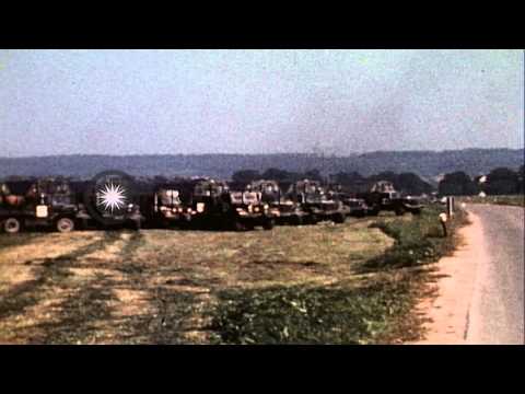 REFORGER 77: track and field vehicles at a field in Germany. HD Stock Footage