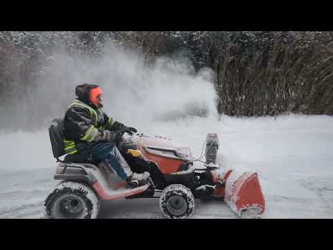 Husqvarna TS348XD with Snow Blower Attachment.