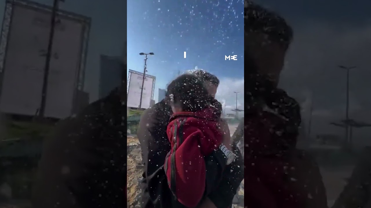 Girl embraces her father after returning to northern Gaza