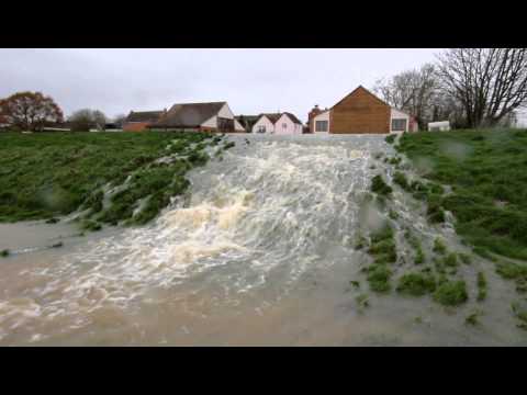 Floodwater spilling from river Parrett Somerset Levels