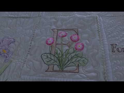 Ribbon Stippling or Ribbon Meander shown here on a Hand Embroidered Quilt. great on applique quilts