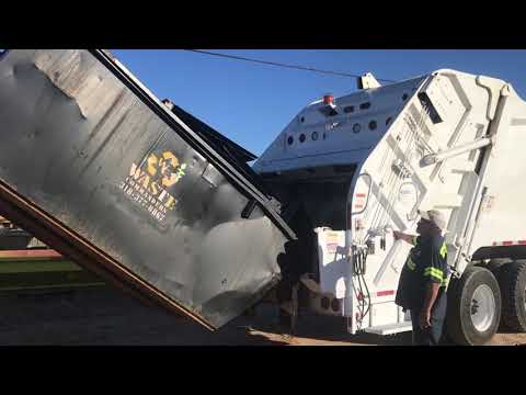Garbage Truck Dumping 8 yd Dumpster