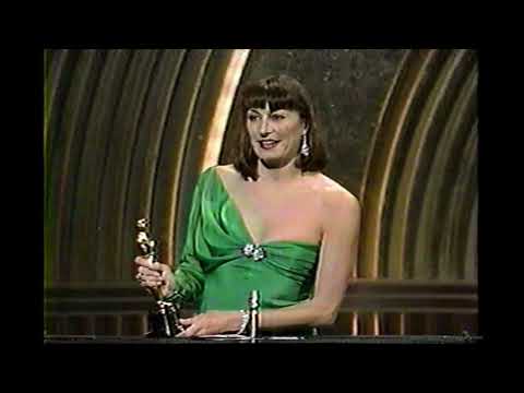Anjelica Huston wins the Academy Award for Best Supporting Actress in Prizzi's Honor
