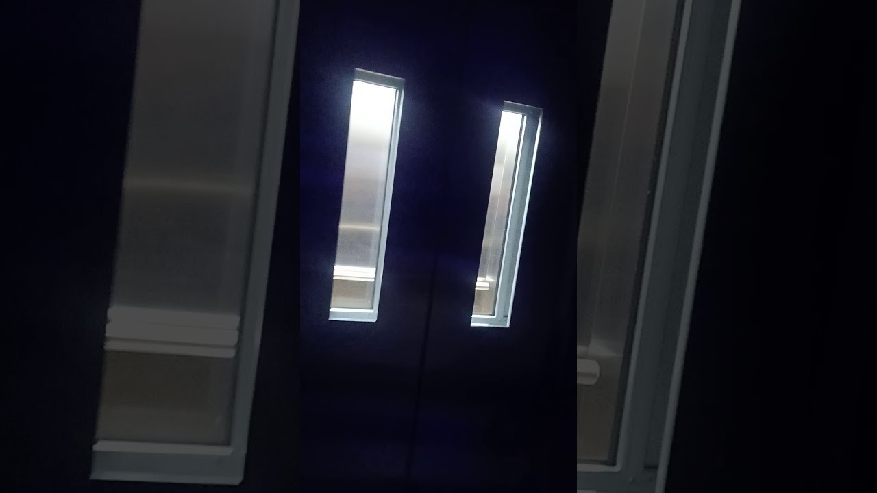 Stainless Steel Center opening SS Small Vision Glass Auto Door Lift- Mobil Elevators Company