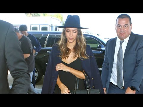 Jessica Alba Sports Matching Coat And Hat Jetting Out Of LAX