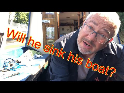 Repacking the stern gland on a narrowboat whilst still in the water. 137