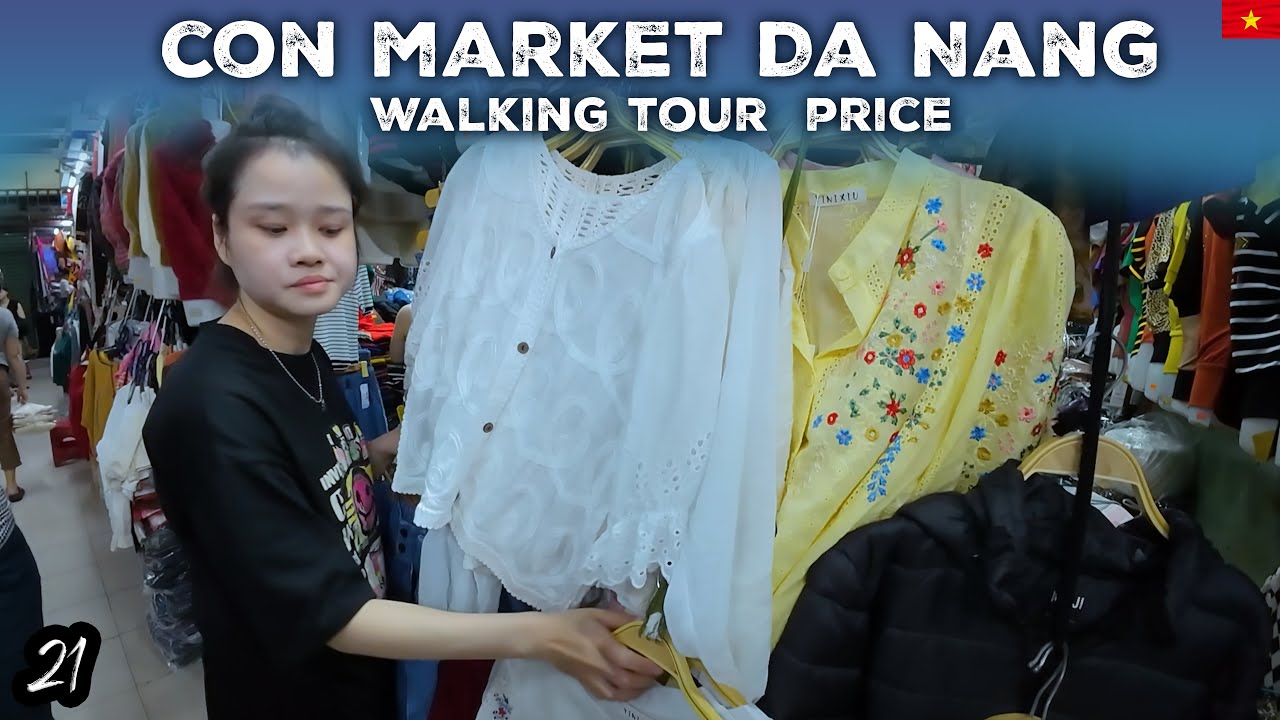 A visitor leisurely strolls through Con Market, soaking in its vibrant ambiance.