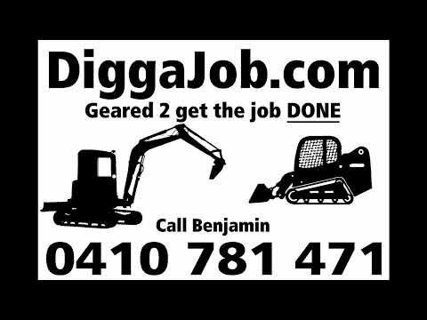 DiggaJob stacking burn pile with the Mecalac 6MCR