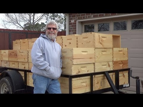 Using hot wax dipping to preserve bee hive boxes