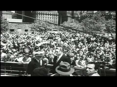 People gather to greet cadets on board a Norwegian sailing ship as it reaches a h...HD Stock Footage
