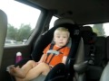 Baby dancing in car seat