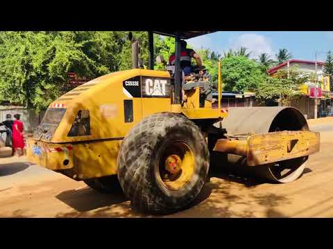 Caterpillar CS533e and Dynapac CC425 Rollers Performing Roadway compaction sub base course top layer