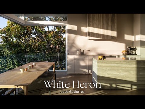 A Quiet Escape from City Life Floats Above a Minimalist Poolscape and a Canopy of Green