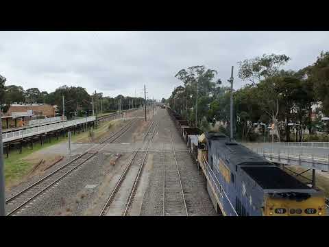 Pacific National's T148 (NR107) arrives and shunts around One Steel in Leightonfield, NSW.