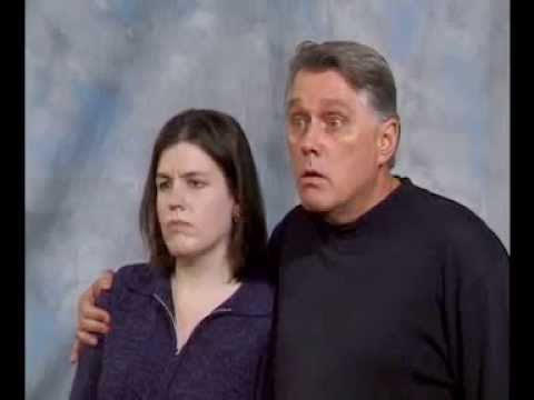 "I WANT A DIVORCE"   (MAN WITH ARM AROUND WIFE)