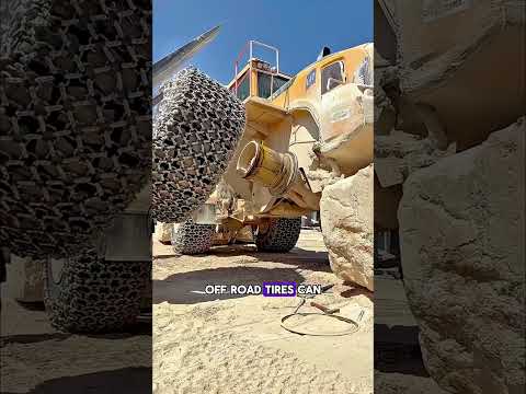 Why are these massive mining tires wrapped in heavy steel chains? (The Answer)