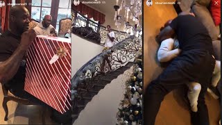 Shaq O’Neal enjoys Christmas with his family while play wrestling with someone