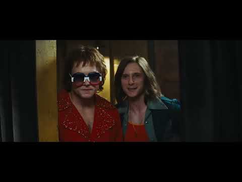 Rocketman official trailer still: Taron Egerton as Elton John in sequined Dodgers outfit at a roaring stadium
