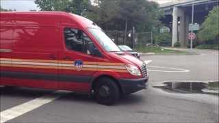 2 TYPES OF FDNY BUILDINGS DIVISION UNITS LEAVING THE FDNY FIRE ACADEMY ON RANDALLS ISLAND IN NYC.