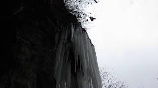 Frozen water fall at the abandoned rock quarry