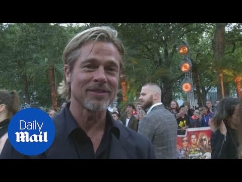 Brad Pitt jokes he and Leonard DiCaprio are 'lovers' at premiere