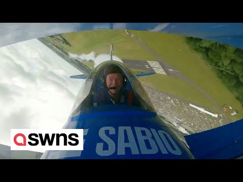 Retired RAF pilot pulls stunts in a aerobatic biplane he built in his shed | SWNS