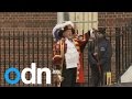 Royal Baby birth announced by town crier outside.
