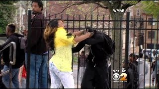 Woman Seen On Camera Disciplining Young Man During Riot