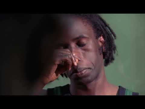 Slam (1998) trailer frame with Saul Williams in a Washington, D.C. courtyard poised to perform