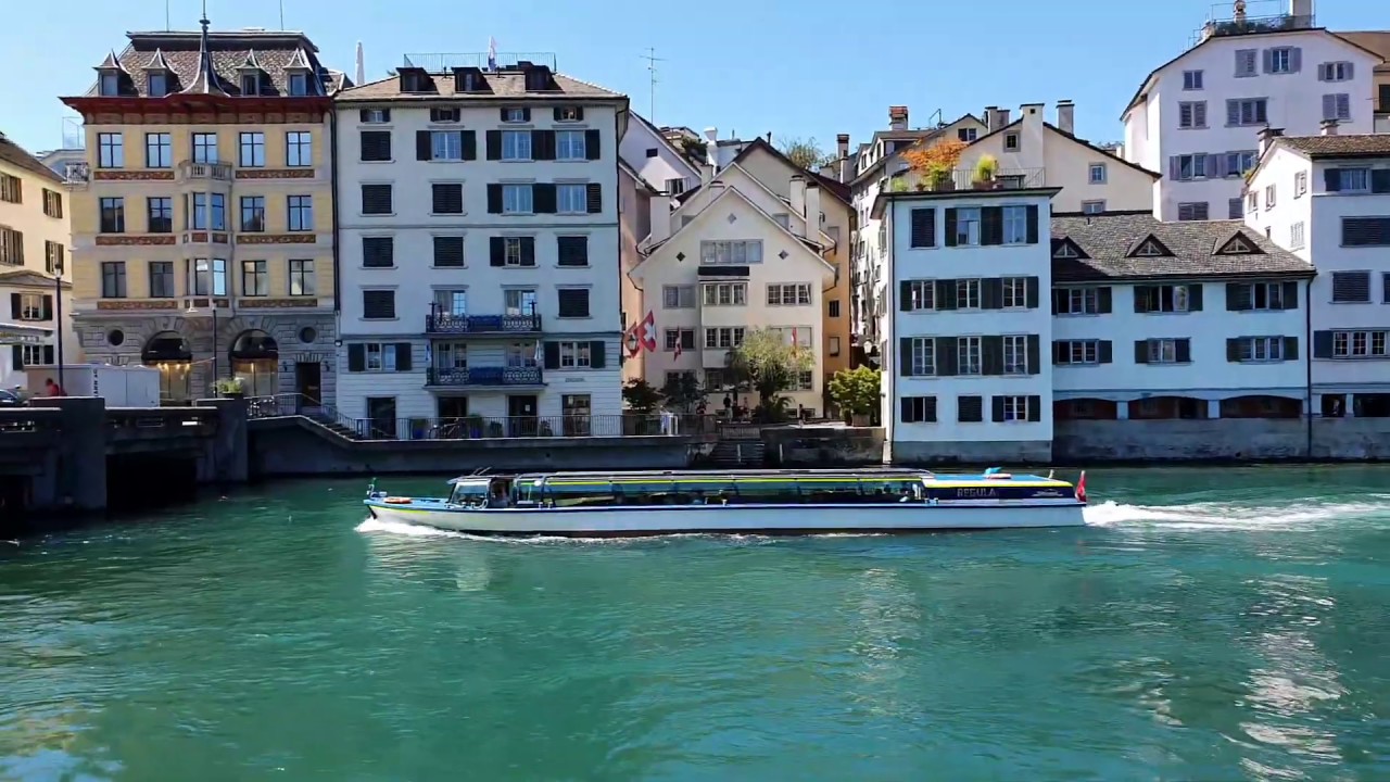 Passing under iconic bridges, Limmat River cruise reveals the architectural wonders of Zurich!