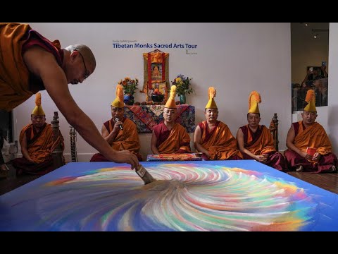 Tibetan monks create a colorful sand mandala