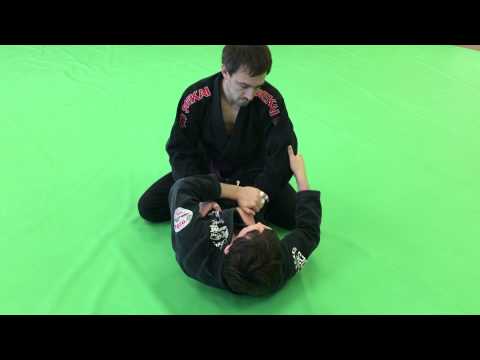 Closed guard wristlock