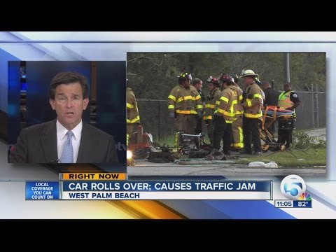 Car rolls over; causes traffic jam
