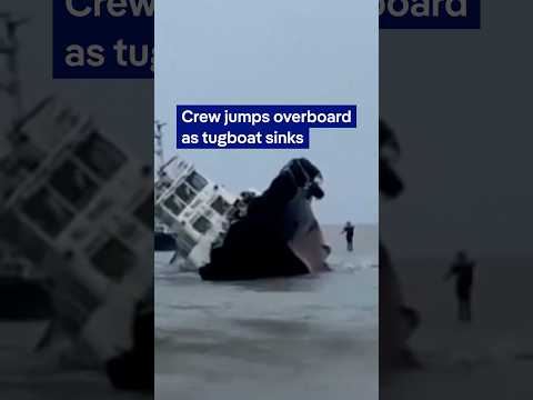The moment a crew jumps overboard as Philippine tugboat sinks | DW News