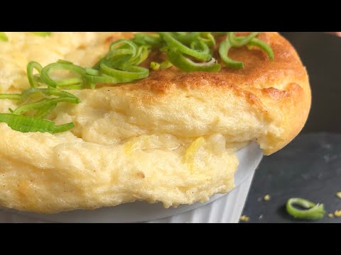 Cheese soufflé recipe, puffed and airy with pecorino, lemon zests, bechamel sauce.