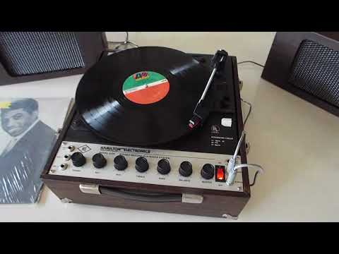 Hamilton Electronics stereo portable record player playing a LP record