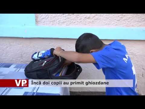 Încă doi copii au primit ghiozdane