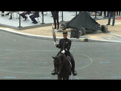 Video Thumbnail: Olympic flame presented during Bastille Day parade in Paris | AFP