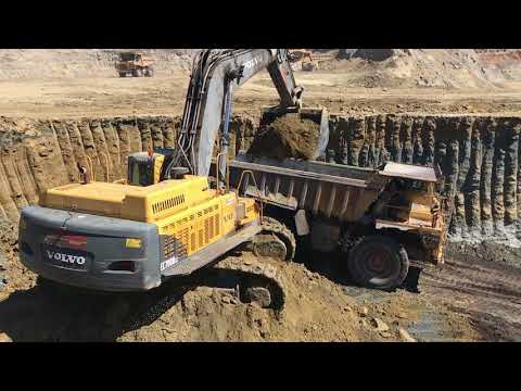 Volvo EC700B Excavator Loading Caterpillar Dumpers