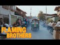 Tuk-tuk chase sequence through a bustling Thai marketplace