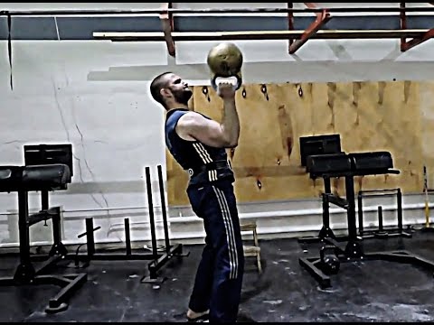Bottom-up push-press of 50 kg (110 lb) kettlebell