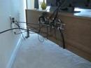 Clear Your Cable Clutter with a Towel Rack