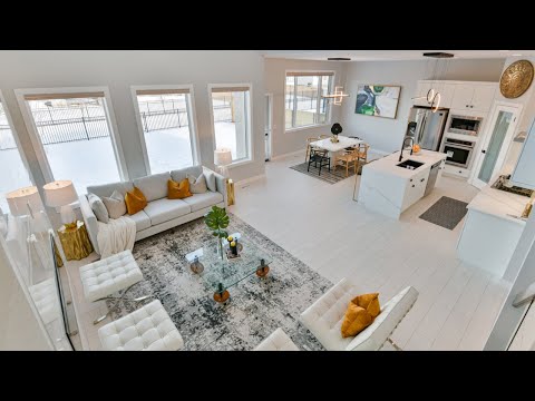 Touring a $729,900.00 home in Bridgewater Lakes with open concept design & 10ft ceiling.