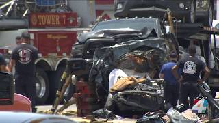 Two killed, two injured in car crash involving truck hauling a trailer and two other vehicles