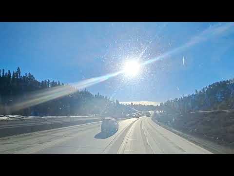 Driving through Donner Pass a few days after a snow storm full speed.