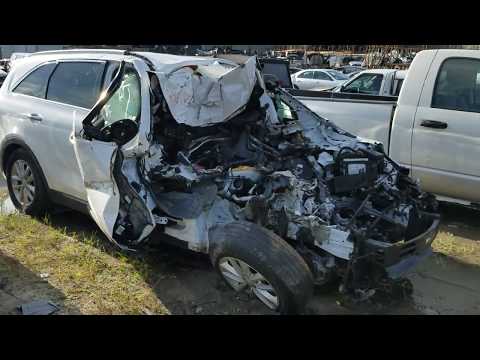 Total front end destruction of a Kia in a salvage yard