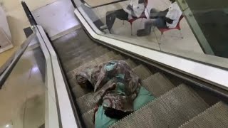 Sleeping On An Escalator