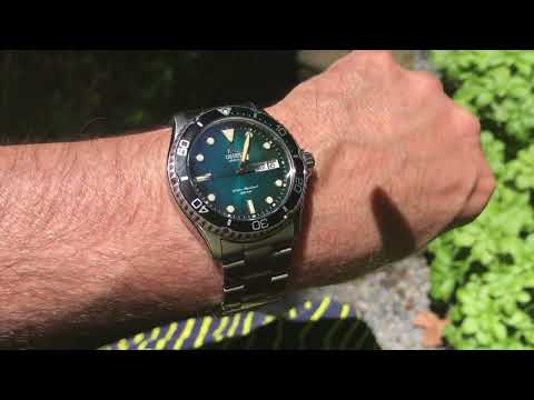 Orient Kamasu 1 green dial compared to Kamasu 2 in direct sunlight